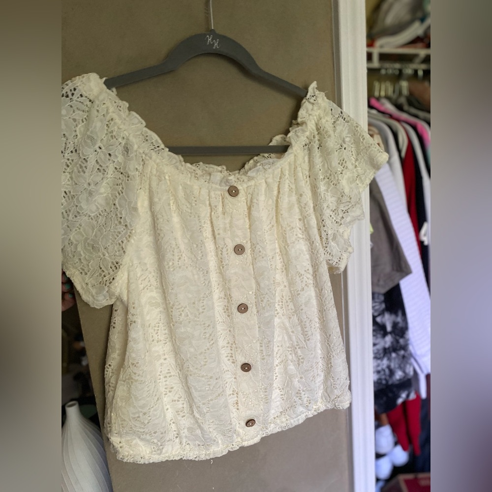 white laced blouse with brown buttons